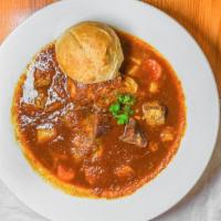 Oxtail · Gluten-Free. A beef soup with a tomato base, potatoes, onions, carrots, and spices. Served w...