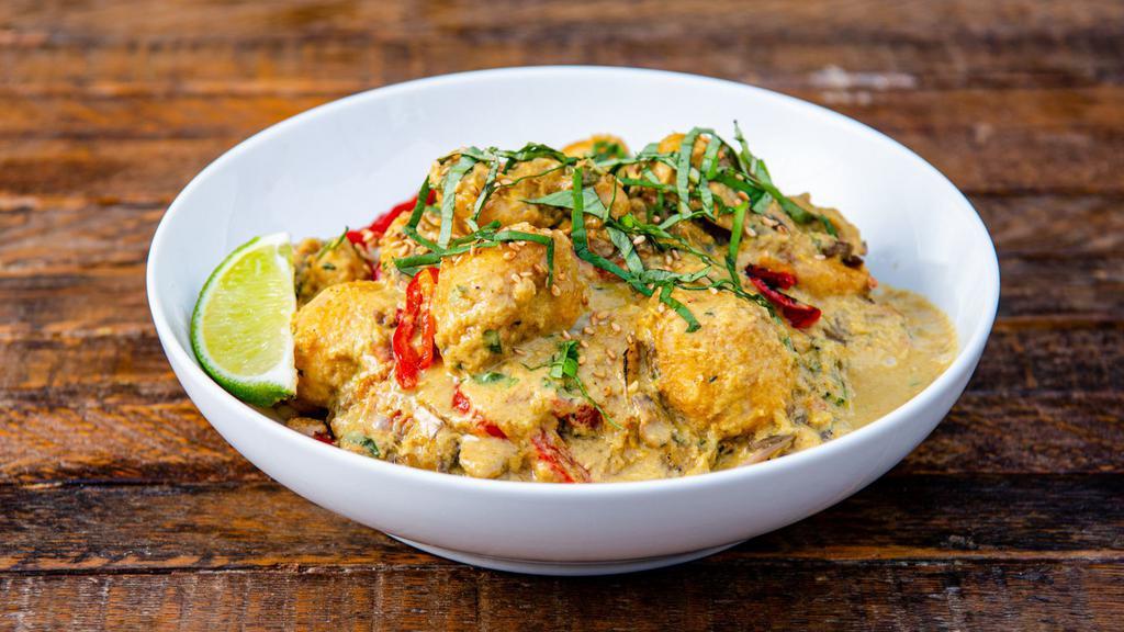 Cauliflower Green Curry Bowl · Flash-fried cauliflower, roasted sweet potatoes, sauteed mushrooms, peppers & onions, basil, sesame seeds, roasted peanuts, and our green curry sauce. Served with a lime wedge and a base of your choice. (Gluten-Free & Vegan)