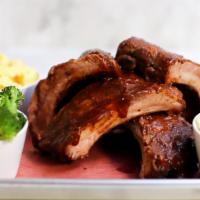 Half Rack Of Baby Back Ribs · Homemade Baby Back Ribs with a piece of homemade cornbread