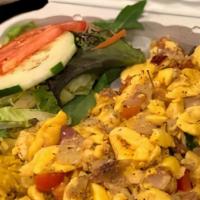 Ackee &Cod Fish Dinner Platter · Jamaica’ national dish. Ackee sautéed with salted Cod chunks along with herbs and veggies, s...