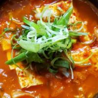 Kimchi Jjigae · Kimchi stew with pork shoulder and tofu.