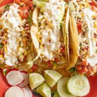 3 Rancheros Tacos · Soft corn tortilla, choice of meat, lettuce, pico de gallo, cheese and crema.