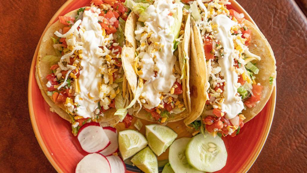 3 Rancheros Tacos · Soft corn tortilla, choice of meat, lettuce, pico de gallo, cheese and crema.