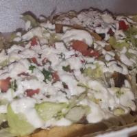 Beef Sopes · Homemade thick tortilla topped with refried beans, your choice of meat,Oaxaca Cheese, lettuc...