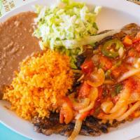 Mexican Style Steak Bisteck · Bistek a la mexicana with onion, red tomato & green peppers.