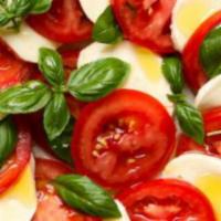 Caprese · sliced tomatoes, fresh mozzarella, basil, balsamic reduction.