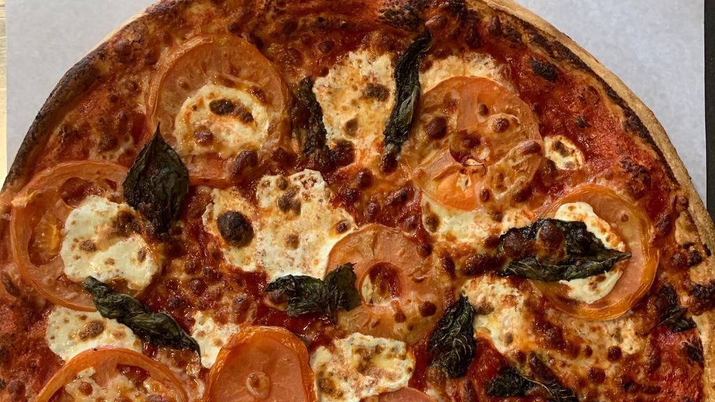 Margherita Pizza · Tomatoes, Fresh Basil Leaf and Fresh Mozzarella Cheese.