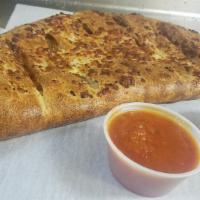 Steak Cheese Calzone · Extra Lean Shaved Steak, American and Mozzarella Cheese.