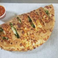 Veggie Calzone · Sauteed Broccoli, Grilled Onions, Mushrooms, Green Peppers Peppers with Extra Mozzarella Che...