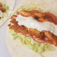 Buffalo Chicken Wrap · Crispy Chicken with Buffalo sauce, Lettuce, Tomatoes and Blue Cheese dressing.