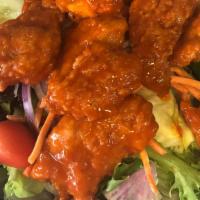 Buffalo Chicken Salad · Crispy buffalo tenders on the top of our garden salad side blue cheese dressing and pita bre...