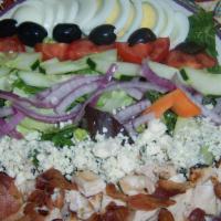 Cobb · Grilled chicken, field greens, hard-boiled egg, bacon, red onion, plum tomato, olives, cucum...