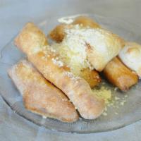 Breadsticks · container of our fresh breadsticks dusted w. pecorino romano w. garlic & oil dipping sauce