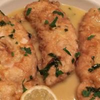 Chicken Francaise · Breast of chicken dipped in an egg and parmesan cheese batter then sauteed with butter and f...