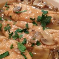 Chicken Marsala · Breast of chicken sauteed with fresh mushrooms in a marsala wine sauce-over linguini.