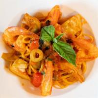 Jumbo Shrimp Puttanesca · Housemade pasta, artichokes, green olives, capers, tomatoes