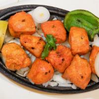 Murgh Tikka · strips of boneless chicken breast marinated in yogurt, herbs and spices, grilled to perfecti...