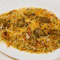 Gosht Biryani · boneless cubes of leg of lamb cooked with saffron basmati rice in mild spices and nuts. Serv...