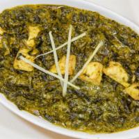 Palak Paneer · homemade farmer's cheese cubes and spinach cooked in a green herbs and spices