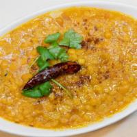 Daal Tarka · traditional Indian yellow lentil cooked with tomatoes and freshly blended spices, garnished ...