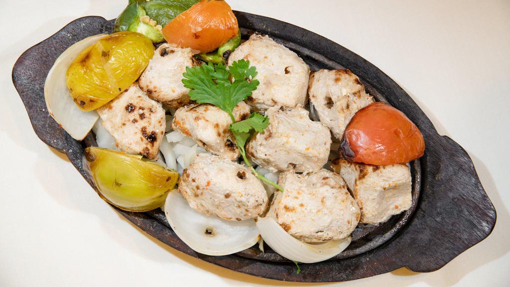 Sheesh Kabab Murgh · strips of boneless chicken breast marinated in yogurt, herbs and spices, skewered with tomatoes, onions, and bell peppers