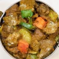 Kadhai Lamb · boneless cubes of lamb cooked on very high heat in a wok with fresh tomatoes, onions, ginger...