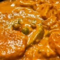 Navratna Korma · A royal entrée, nine vegetables cooked in a mild creamy sauce, sprinkled with dry nuts.