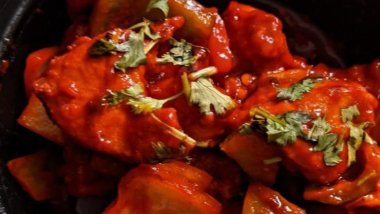 Chilly Chicken · Cubed chicken stir-fried Indo-Chinese style with peppers in a tangy sauce.