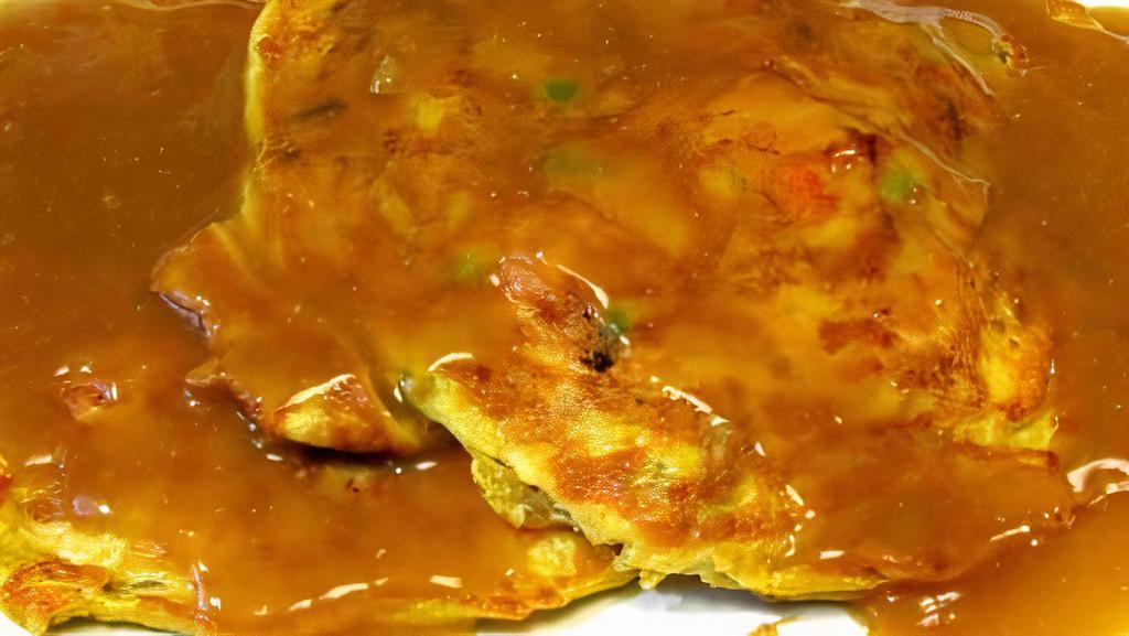 Chicken Egg Foo Young Combination With An Egg Roll · 