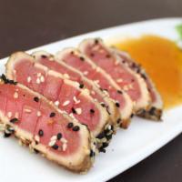 Ahi Tuna · Marinated and seared rare, with seaweed salad and cucumber-wasabi dressing