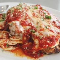 Chicken Parmesan · Pan fried cutlet topped with fresh mozzarella cheese over linguini with housemade marinara.