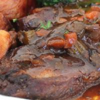 Bud'S Tuscan Short Ribs · Tender beef short ribs, slow cooked in a red wine vegetable sauce, with chef's selection sta...