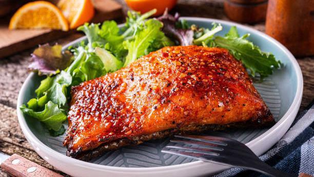 Salmon Citrus Glaze · Grilled salmon with a sweet honey citrus dijon glaze, with chef's selection starch and vegetable