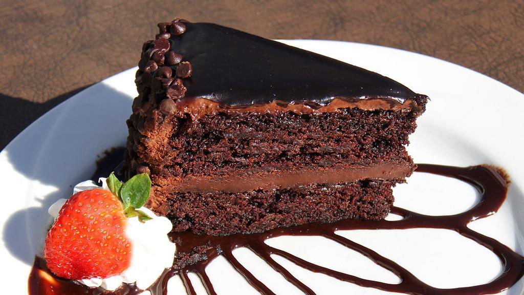 Triple Chocolate Cake (Slice) · Two incredibly rich and moist layers of chocolate cake topped with a creamy chocolate frosting and covered in rich, chocolate chips.