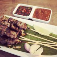 Lamb Satay Skewer · Marinated lamb meat, skewered and grilled. served with sweet soy sauce and peanut sauce.