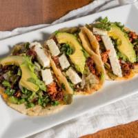 Tacos Atexquita · Order of 3. Handmade corn tortillas with Mexican sausage, beans, avocado, fresh cheese and c...