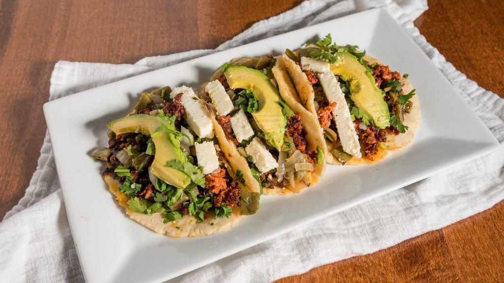 Tacos Atexquita · Order of 3. Handmade corn tortillas with Mexican sausage, beans, avocado, fresh cheese and cactus