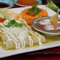 Enchiladas Verdes · 4 chicken enchiladas covered in green sauce. Served with rice, beans and salad.