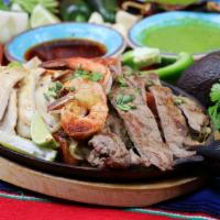 Fajitas Mixtas · Seasoned and grilled chicken, steak, and shrimp cooked with bell pepper, onion and tomato. S...