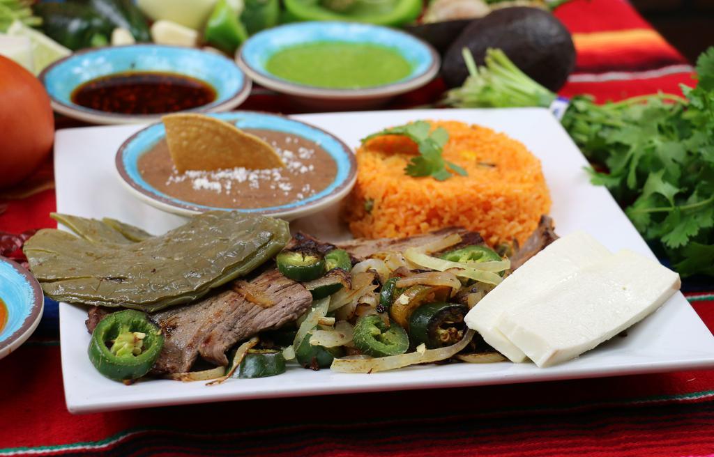 Carne Asada Platter · Grilled flank steak with onion, jalapeno, and poblano peppers, cactus and queso fresco. Served with rice, beans, and tortillas.