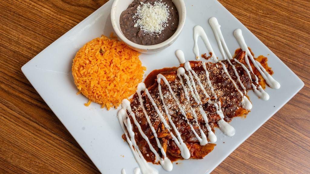 Alambre Poblano · Steak, bacon, ham, and poblano pepper grilled with bell pepper and onion. Topped with melted Oaxaca cheese and served with flour or corn tortillas.