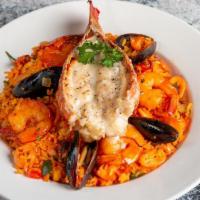 Seafood Casserole · Lobster, calamari, shrimp, mussel, and rice.
