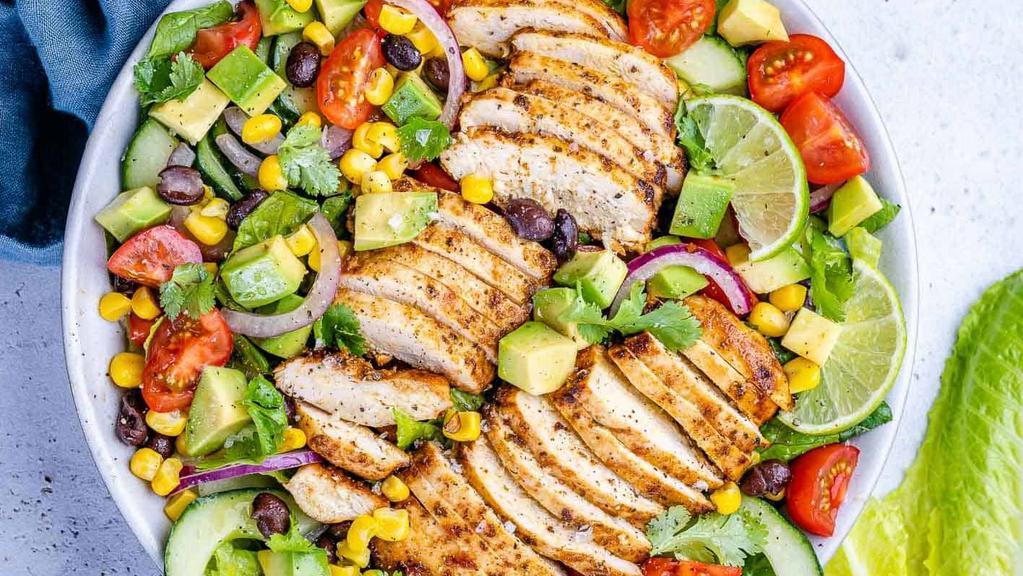 Southwest Chicken Salad · Grilled sliced chicken with avocado, tomato, red onion, corn, black beans, chopped romaine, and cilantro vinaigrette.