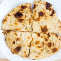 Naan · Traditional white bread, baked in the tandoor.