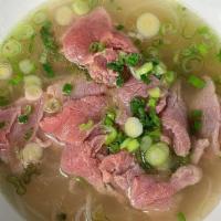 Medium Rare Beef Pho · -	Rice noodles 
-	Thinly sliced beef eye round
-	Green onions 
-	White onions
-       Cilant...