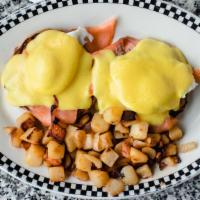 Atlantic Eggs Benedicts · Smoked salmon. Served with two poached eggs on a grilled English muffin. Topped with Holland...