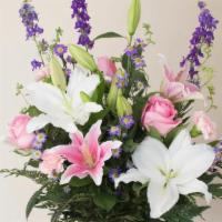 Rose And Lily · This guest favorite features beautiful Stargazer Lilies and Roses with a-swirl with pink, wh...