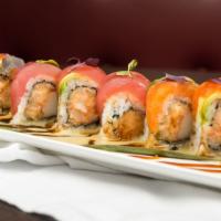 Lobster Rainbow · Spicy crunchy lobster and kani inside topped with tuna, salmon, and avocado, yuzu miso eel s...