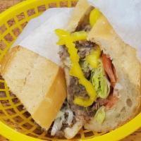 Cheesesteak · Beef Philly cheesesteak and American cheese on freshly baked bread toasted in panini press