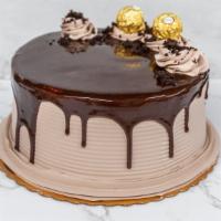 Chocolate Chocolate Cake · Devil food Chocolate Cake covered in chocolate whipped icing with chocolate drizzle and garn...